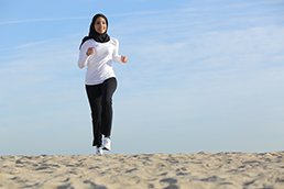 Woman walking on a beach